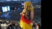 German girl flashes from the last row in a stadium [GIF]