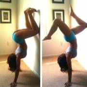 A handstand in tight blue yoga shorts
