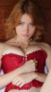 Redhead busting out of her corset