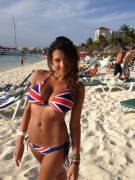 Busty beach babe bearing British branded bikini