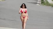 Sophie Dee strutting her stuff a red bikini