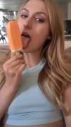 Showing off her talents with a popsicle