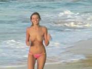 Carli Banks running on the beach