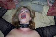 Collared MILF cumslut smiling with a hot load on her face