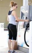 sexy cute girl in yoga pants at gas station