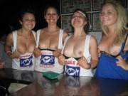 Four chicks proudly flashing their tits