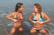 Two friends flashing at the beach