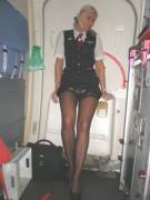 Lufthansa Stewardess pulling up her dress