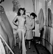 Yvonne Ménard preparing with her dresser at the Folies Bergère, Paris, France early 1950s