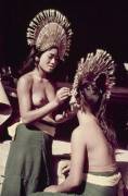 Tourist getting painted, Polynesia, circa 1960s