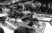 A front and rear view of Venetia Day posing topless on a Matra MS120 at the 1971 London Racing Car Show at Olympia in London