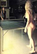 Candice Thayer playing ping pong with writer Henry Miller, 1971