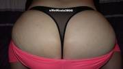 Pink leggings but more of black thong and a$$