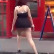 Drunk girl lifts up her skirt and falls