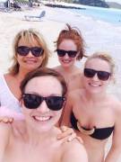 3 sisters in bikinis with their mom