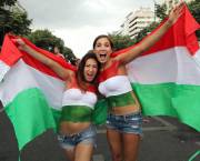 Two beautiful girls in the street with their Hungarian flags (x-post /r/FlagBabes)