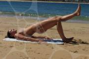 Michelle Jenneke stretching on the beach