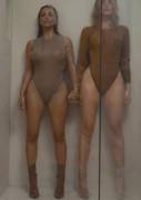 Kim and Khloe in bathing suits in a shower