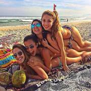 Sexy pile-up of babes on the beach