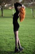 Redhead posing in a field