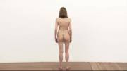 This "performance art" is literally a naked woman stood immobile in a room, with a voiceover