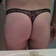Sub guy in black lacy thongs with a pink bow