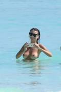 Emily Ratajkowski topless at beach in Cancun