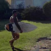 A Hot Naked Man, With A Surfboard Under One Arm, A Bottle Under The Other, Running Across The Garden, Whilst His Mate Trying To Stop Him, Drops The Surfboard, &amp; Runs Into The Bushes ..... Just The Antics On An Australian Soap Opera!!!!!! 
