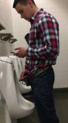 Distracted guy taking a leak