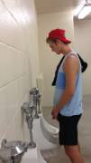 Young guy preparing to piss
