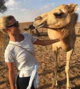 Nina Agdal and camel say hello