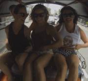 3 FlashingGirls in sunglasses traveling down the road [gif]