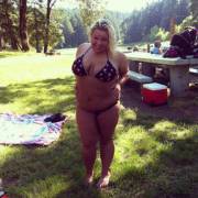 Big girl in a bikini at the summer picnic