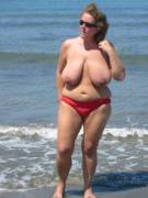Heavy hangers on this topless mature lady
