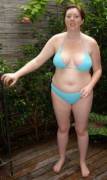 Chubby ginger in a small blue bikini