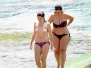 Topless chick and her chubby friend at the beach