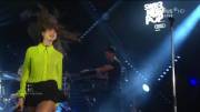 Dua Lipa on stage in a very short skirt