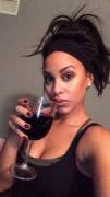 Playboy Playmate Kaylia Cassandra with a glass of wine