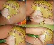 Homer Simpson eating a cucumber
