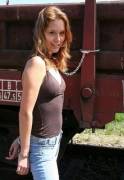 Smiling redhead cuffed outdoors