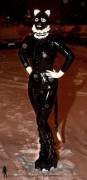Out in the snow in her latex catsuit
