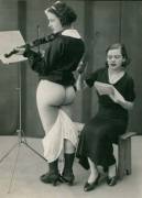 The former Suffragette leader receives a hard ruler spanking on her buttocks whenever she misses a note practicing for the Violin Concerto: The Downfall of the Petticoat Tyranny