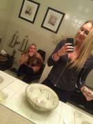 2 blondes in the bathroom.