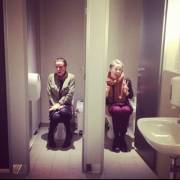 Two girls caught peeing in public toilet stalls