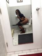 Big Booty Black Girl takes a selfie while peeing on the toilet