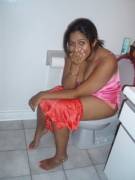 Happy indian girl in the toilet