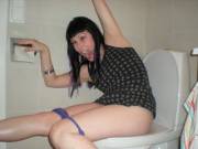 Looks like she's about to fall off toilet
