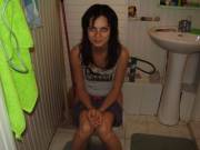 Girl peeing in the toilet