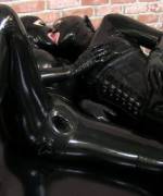 Latex sheaths in her ass and pussy
