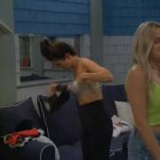 Holly readjusting her bra changing in the bathroom GIF
